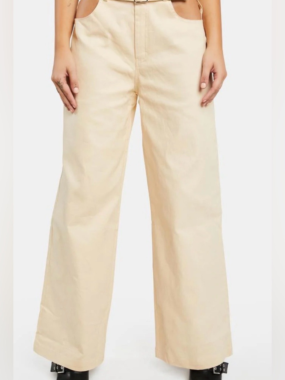 Bailey Rose Cut Out Flare Pants in the color cream, Dolls Kill. Size S